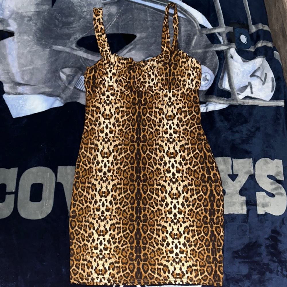 Cheetah print body con dress. New without tags